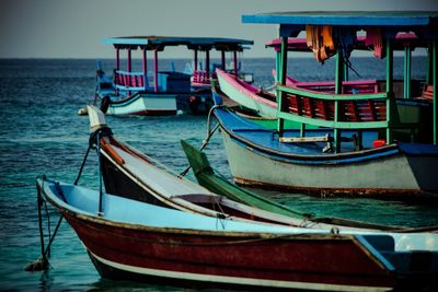 Boats moored in sea