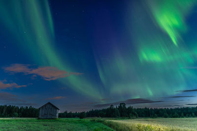 Scenic view of field against sky at night