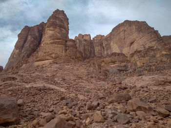 Rock formations on landscape against sky