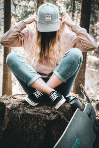 Midsection of woman wearing hat