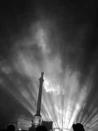 Low angle view of monument against cloudy sky