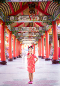 Full length of woman standing in building