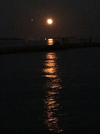 Scenic view of sea against sky at night