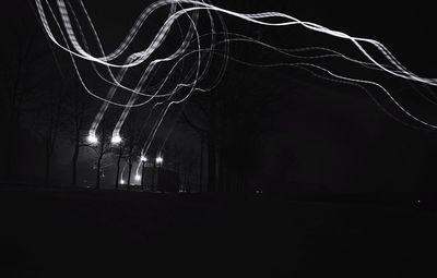 Low angle view of light trails at night