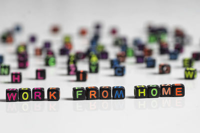 Close-up of toys on table against white background