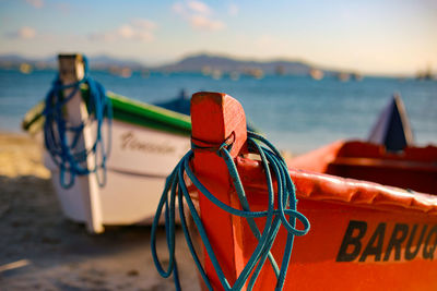 Close-up of rope tied on beach