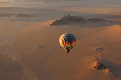 Hot air balloons against sky during sunset