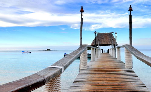 Pier over sea against sky
