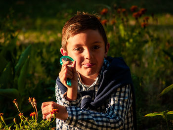 Portrait of boy holding seed