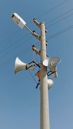 Low angle view of street light against sky