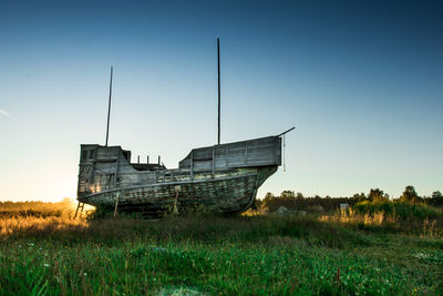 An old vikings boat staying on grass. russia, karelia. high quality photo