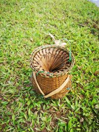 High angle view of wicker basket on field