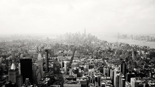 High angle view of modern buildings in city against sky
