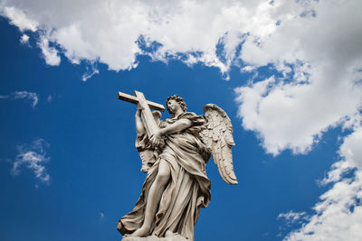 Low angle view of statue against sky