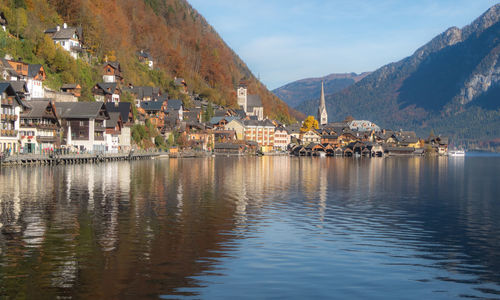 Town by sea against sky