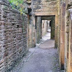 Narrow footpath along old building