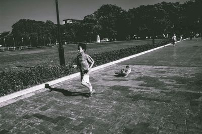 Woman walking on road