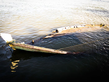 High angle view of shipwreck sinking in sea