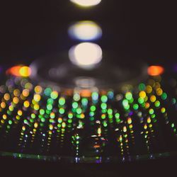 Close-up of illuminated lights at night