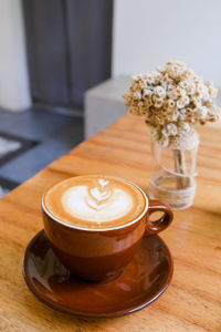 Close-up of cappuccino on table
