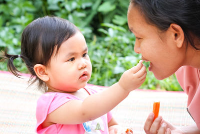 Portrait of mother and baby girl