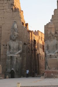 Statue of historic building against sky