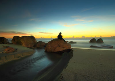 Scenic view of sea at sunset