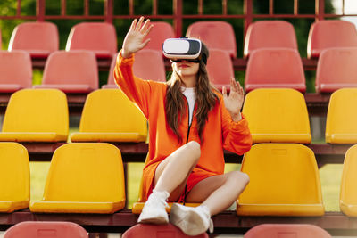 A young athlete wearing virtual reality glasses, dressed in sportswear