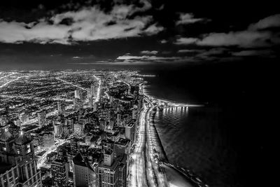 High angle view of city against cloudy sky