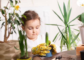 Portrait of boy eating food at home