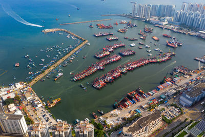 High angle view of sea and buildings in city