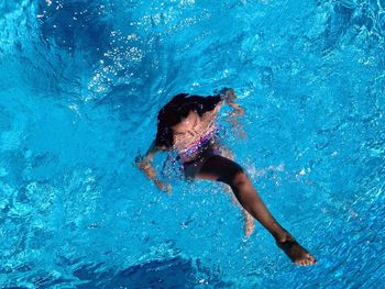 Woman playing in swimming pool