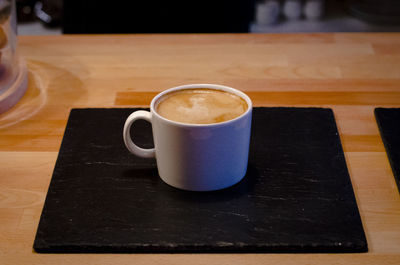 High angle view of coffee cup on table