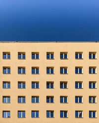 Low angle view of building against blue sky