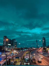 High angle view of illuminated buildings against sky at night