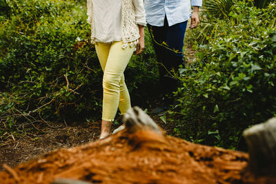 Low section of person standing on field