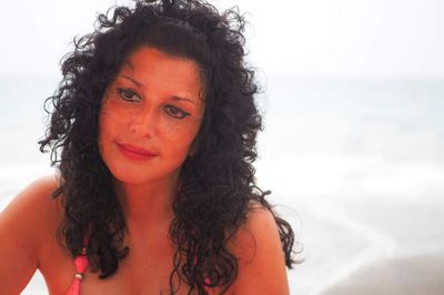 Portrait of a smiling young woman at beach