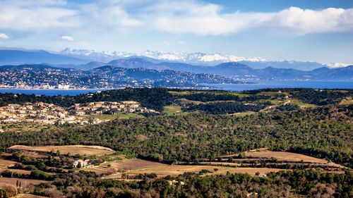 Scenic view of landscape and mountains against sky