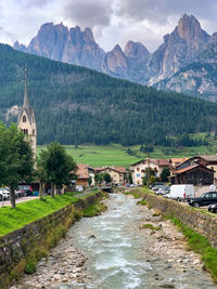 Panoramic view of buildings and mountains against sky