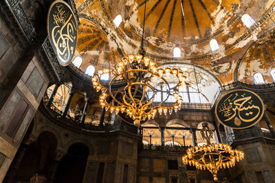 Low angle view of illuminated ceiling of building