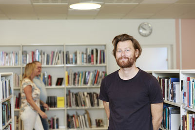 Man in library looking at camera