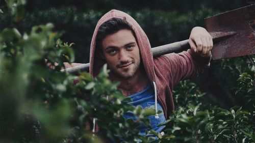 Portrait of man against plants