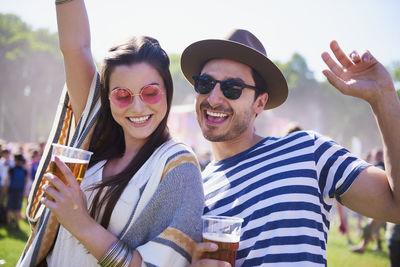 Friends dancing at music festival