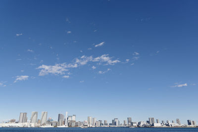 A view of the rainbow bridge and odaiba from the shibaura minami futo park