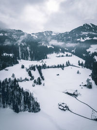 Scenic view of snow covered mountains against sky