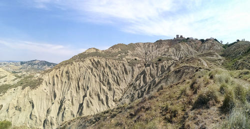 Scenic view of rocky mountains against sky