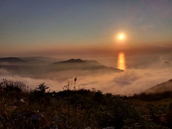 Scenic view of mountains against sky during sunset