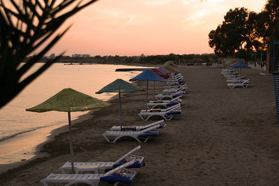 Scenic view of beach against sky during sunset