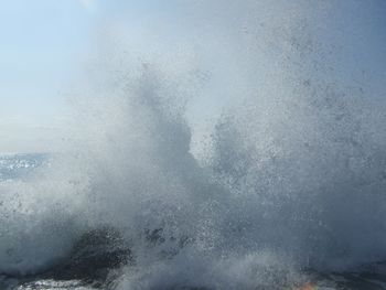 Waves splashing on water