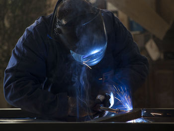 Close-up of man wearing welding mask